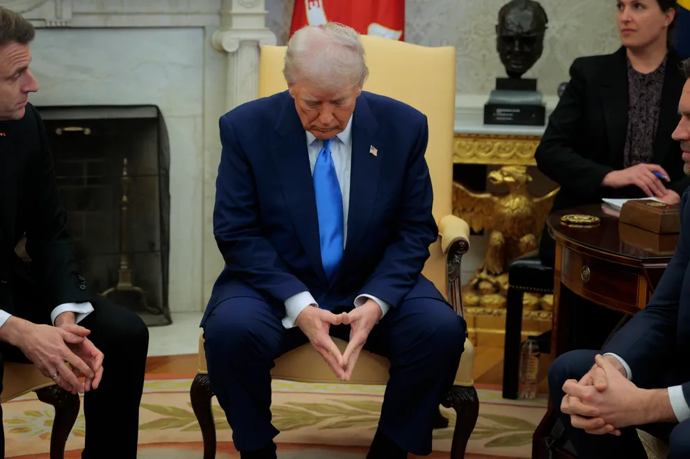 Donald Trump hosts French President Emmanuel Macron for meetings in the Oval Office at the White House in Washington, DC, on February 24, 2025 | Source: Getty Images