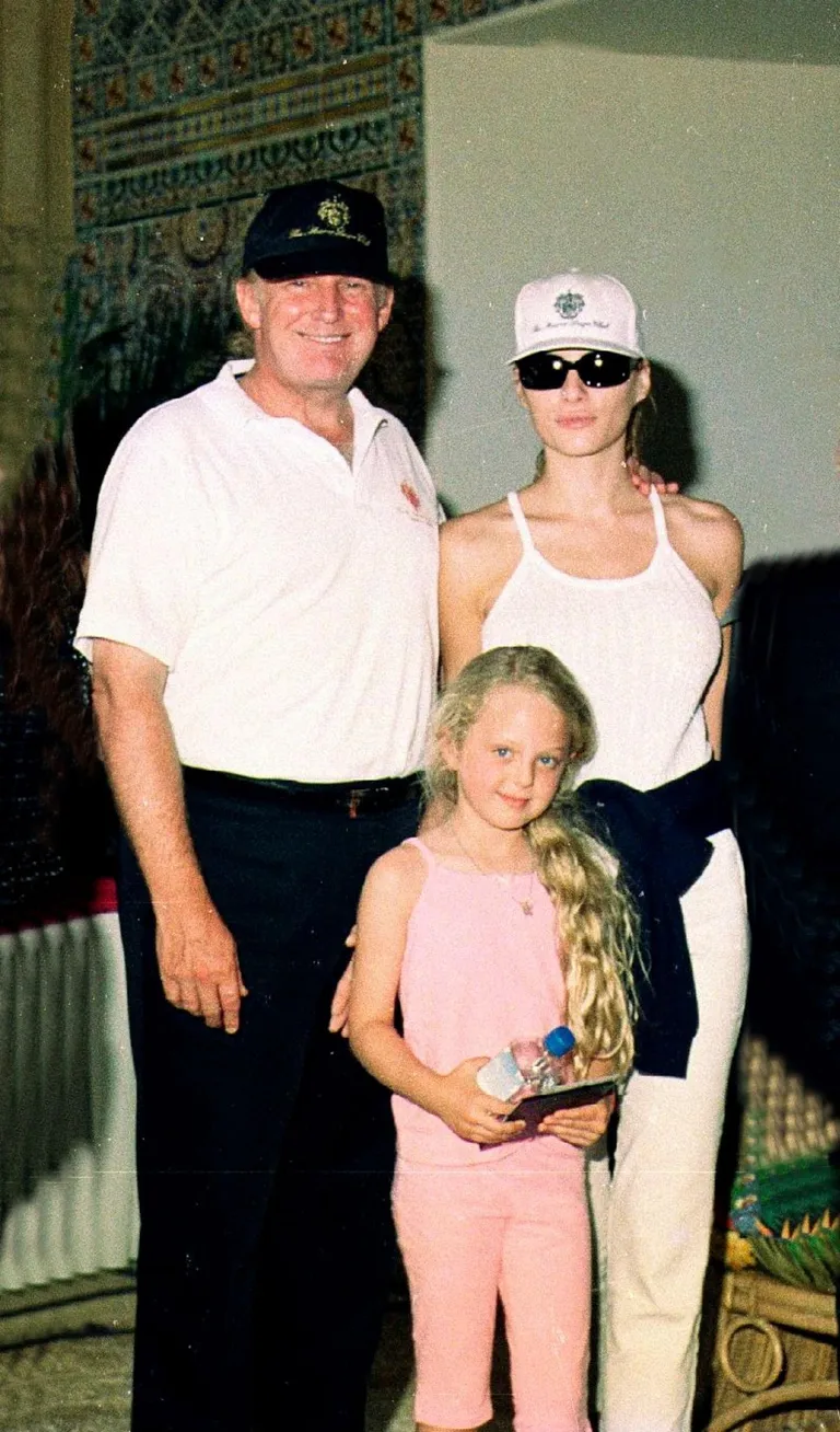 Donald and Melania Trump with his daughter Tiffany at the Mar-a-Lago estate in Palm Beach, Florida, on April 2, 2000. | Source: Getty Images