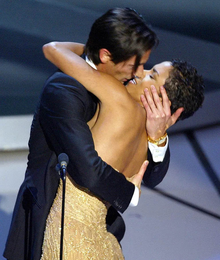 Adrien Brody kisses Halle Berry during the 75th Academy Awards at the Kodak Theatre in Hollywood, California, March, 23, 2003. | Source: Getty Images